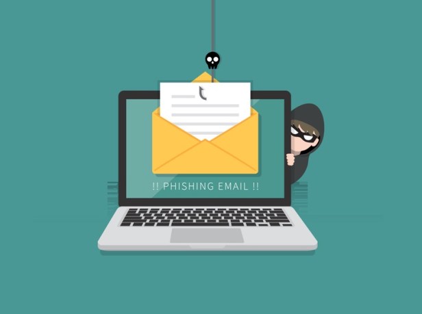 Email data phishing with cyber thief hide behind Laptop computer. Hacking concept.