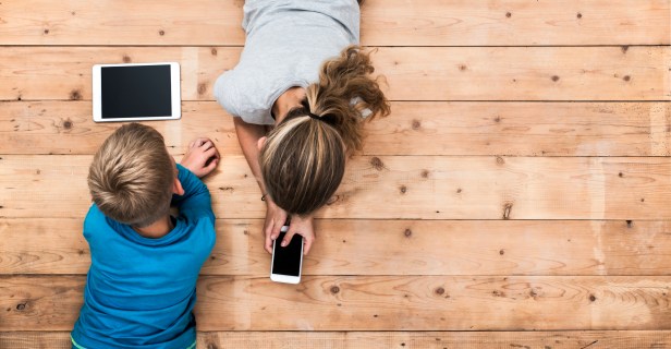 Kids playing with mobile devices header